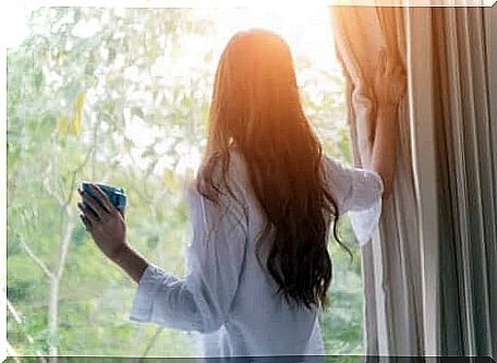 Woman looking out the window