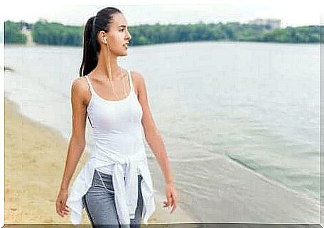 Woman walking along the sea 