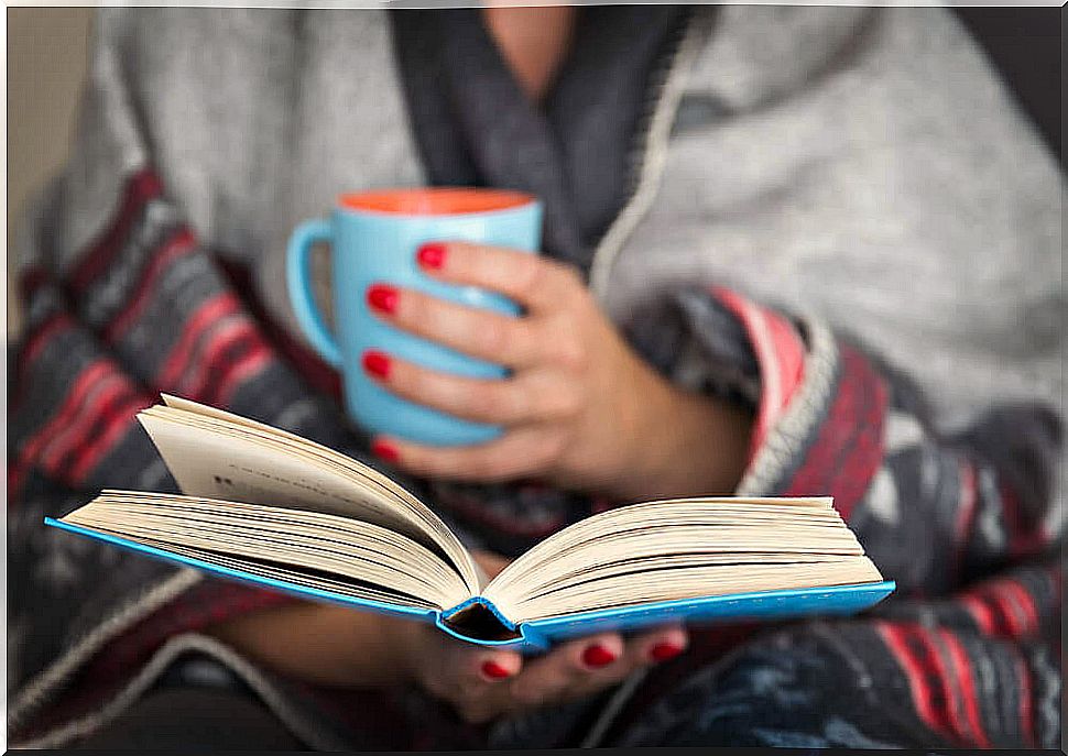 A woman reading a book in her forties