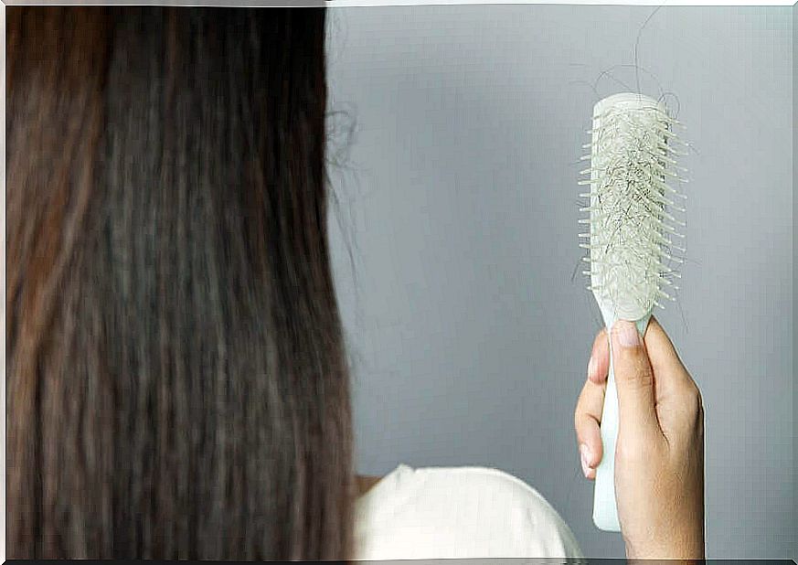 A woman's hair on her brush